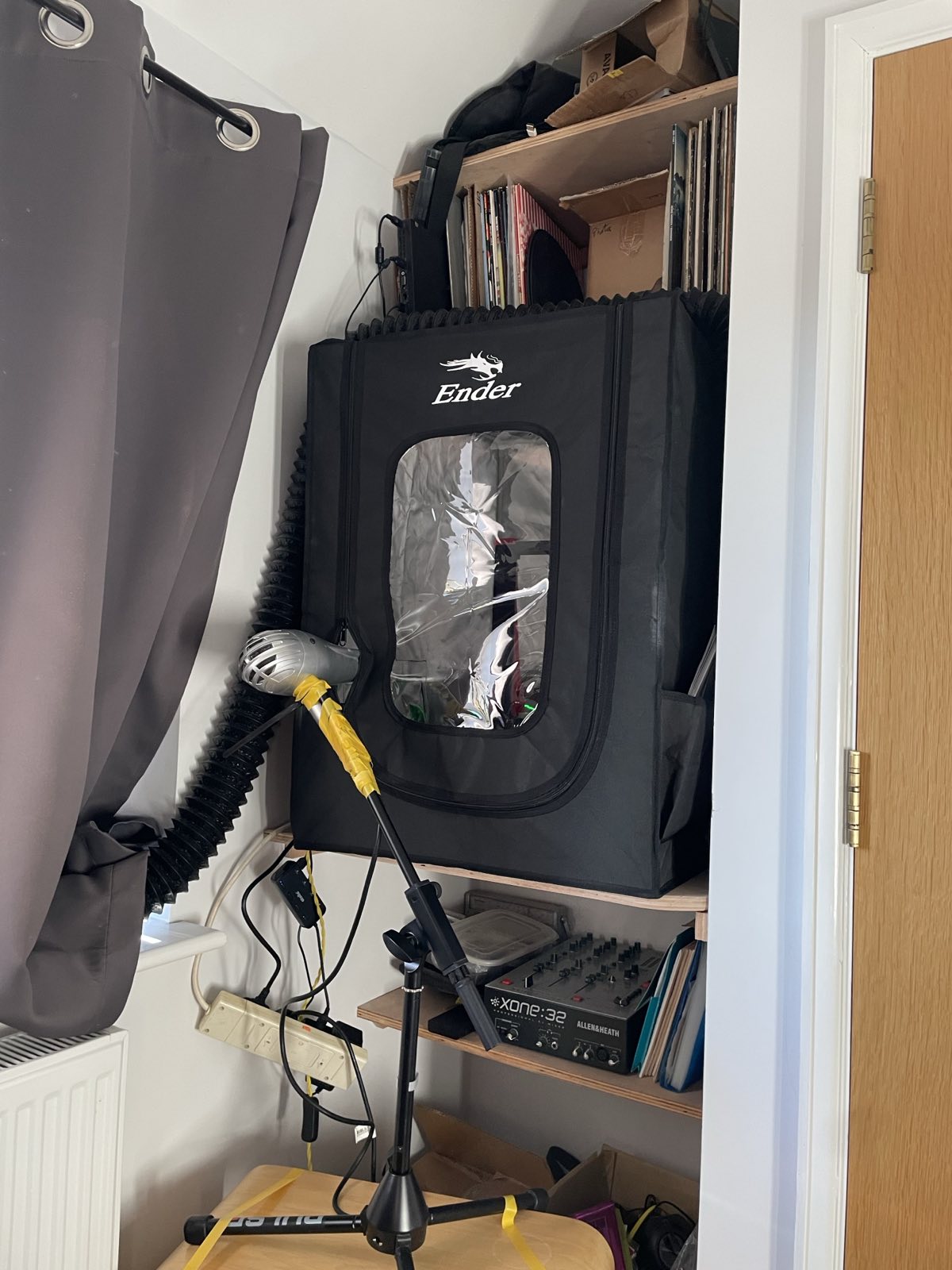 printer enclosure with hair dryer on a mic stand poking inside